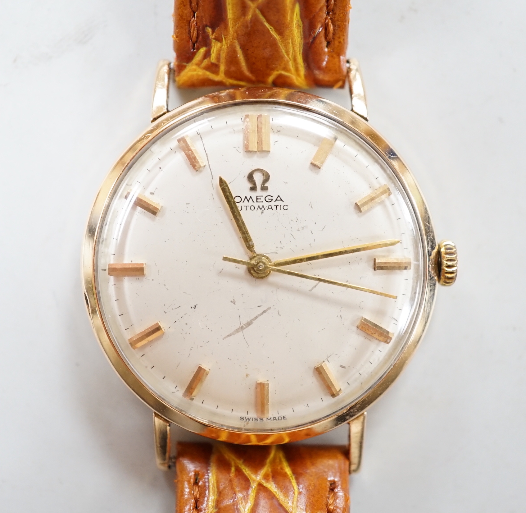 A gentleman's 1960's yellow metal Omega automatic wrist watch, movement c.552, on later associated strap, cased diameter 32mm, no box or papers.